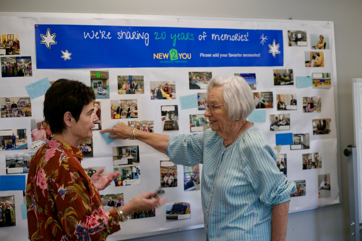 Volunteers looking at a picture board