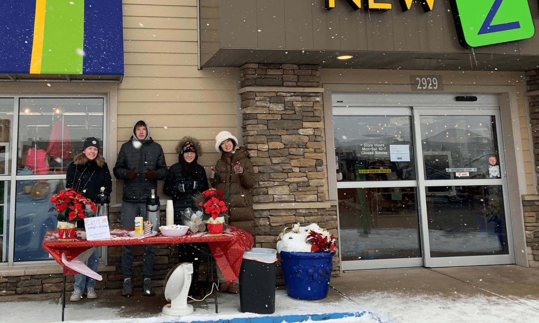 Students from Grand Rapids Christian High School serving hot chocolate and coffee to New 2 You customers