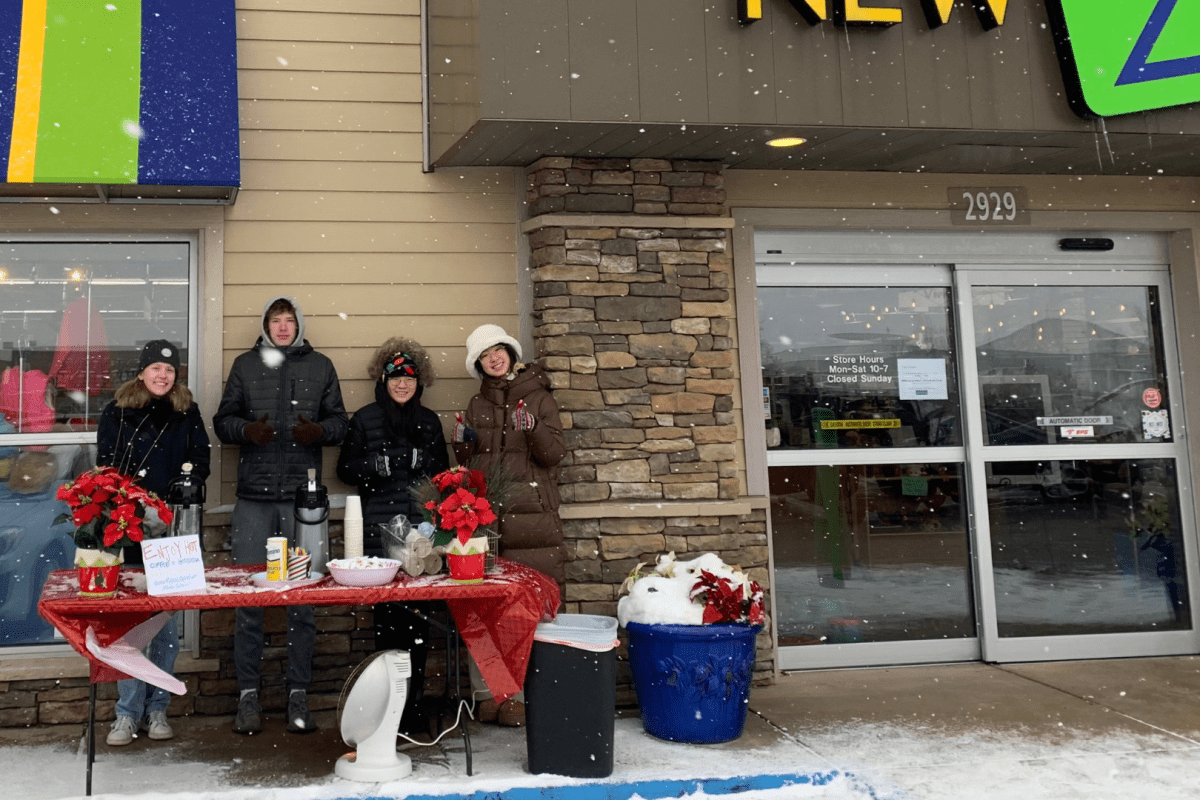 Students from Grand Rapids Christian High School serving hot chocolate and coffee to New 2 You customers