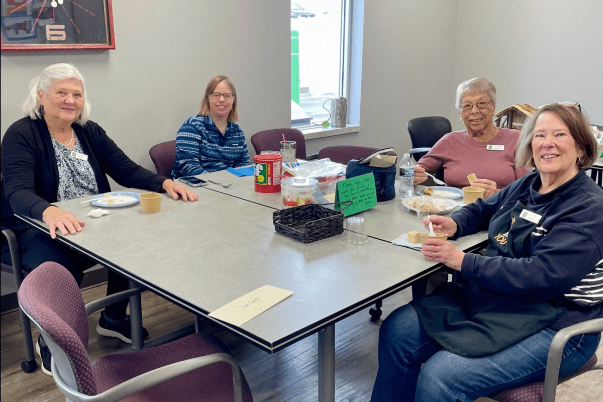 Volunteers celebrating Christmas with a potluck
